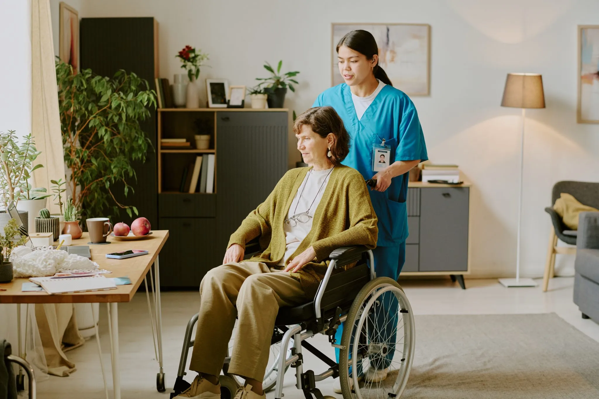 Caregiver assisting senior woman
