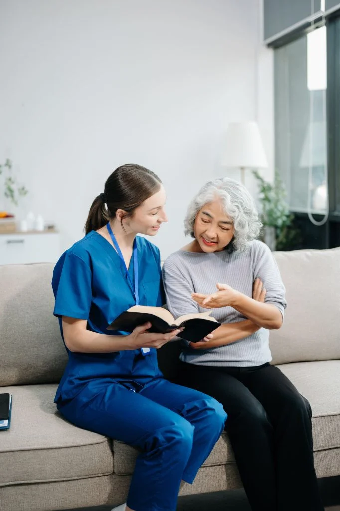 Caregiver assisting elderly client