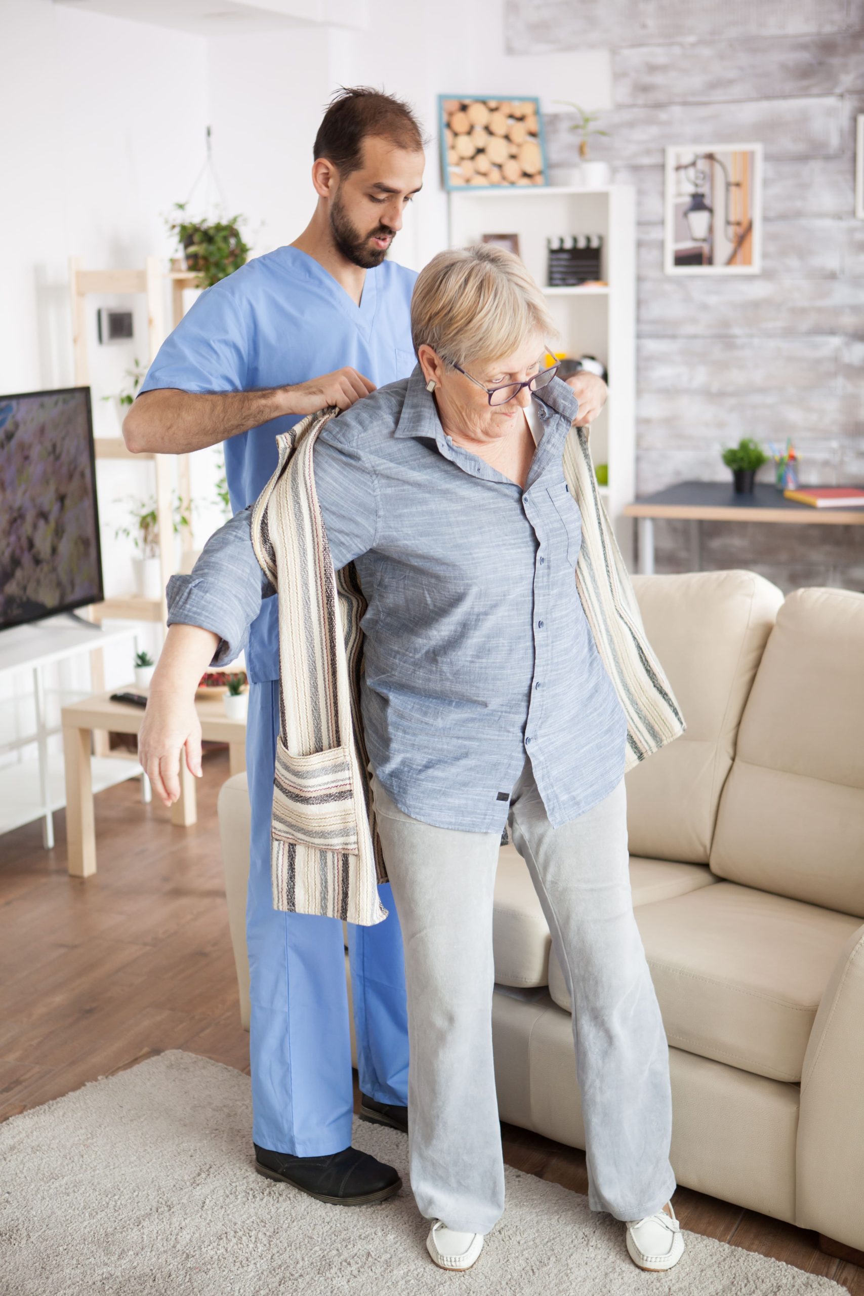 Caregiver assisting an older adult at home
